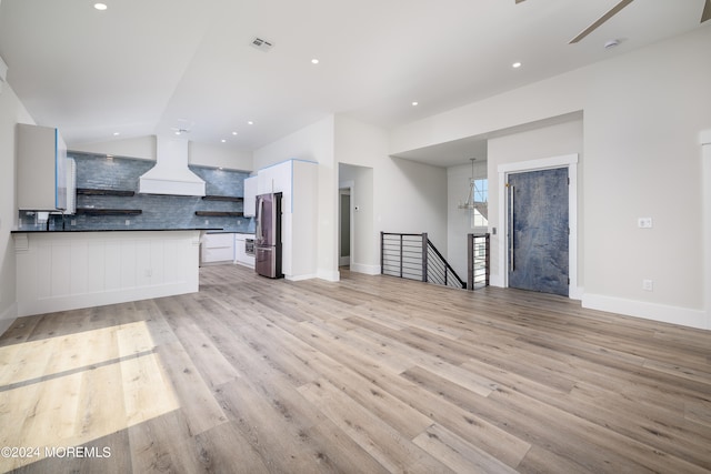 unfurnished living room with light hardwood / wood-style floors