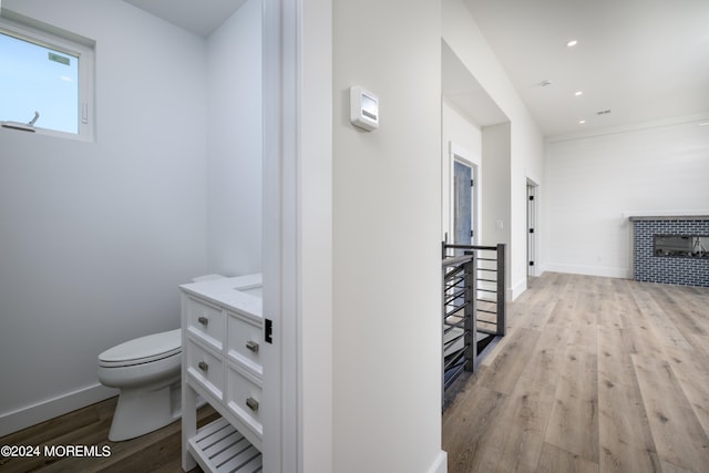 corridor with light hardwood / wood-style floors