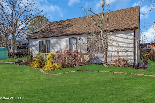 back of house with a yard