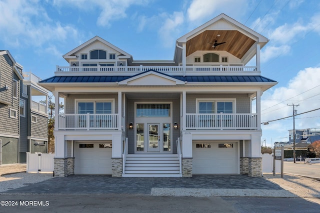 view of front facade with a balcony and a garage