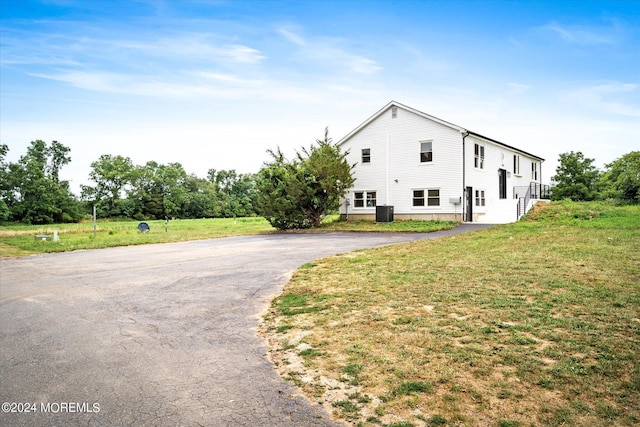 view of side of home featuring a yard