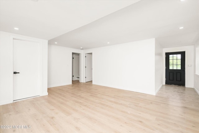 unfurnished room with light hardwood / wood-style floors