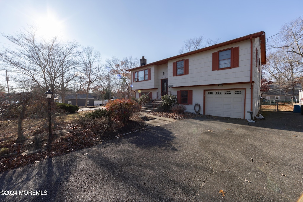 raised ranch featuring a garage