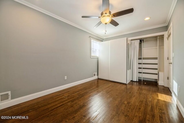 unfurnished bedroom featuring ceiling fan, dark hardwood / wood-style flooring, and crown molding