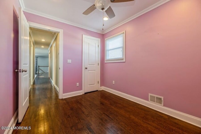 unfurnished bedroom featuring crown molding, ceiling fan, and dark wood-type flooring