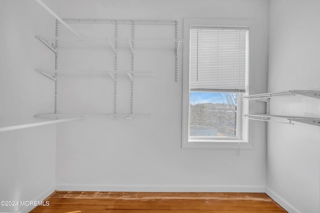 walk in closet featuring wood-type flooring