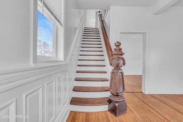 stairway featuring hardwood / wood-style floors