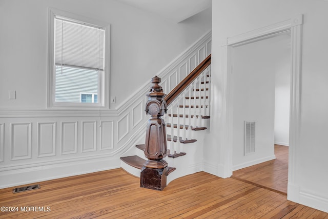 staircase featuring wood-type flooring