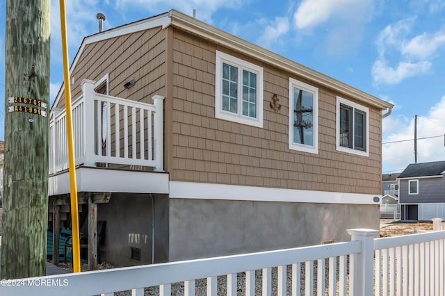 view of property exterior featuring a balcony