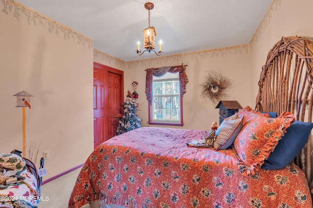 carpeted bedroom featuring a closet and a notable chandelier