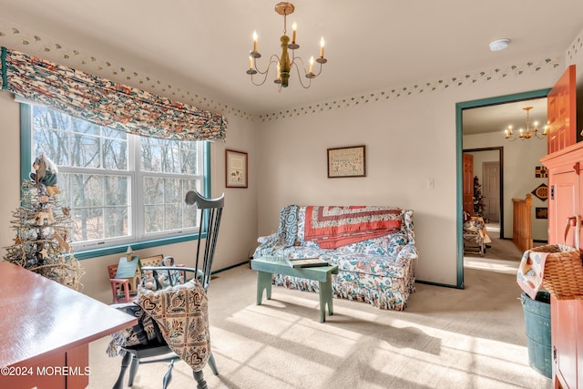 living area featuring carpet flooring and a chandelier