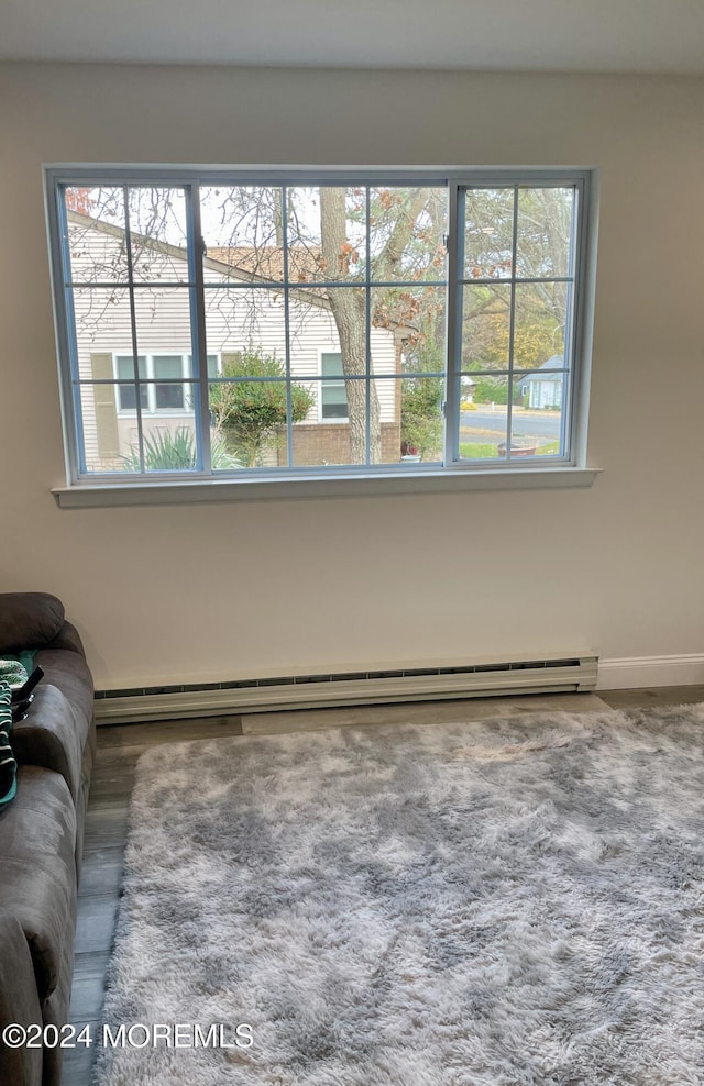 living room featuring carpet and a baseboard radiator