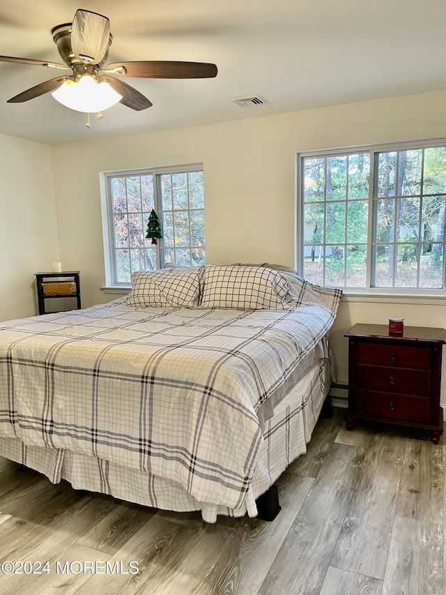 bedroom featuring hardwood / wood-style floors and ceiling fan