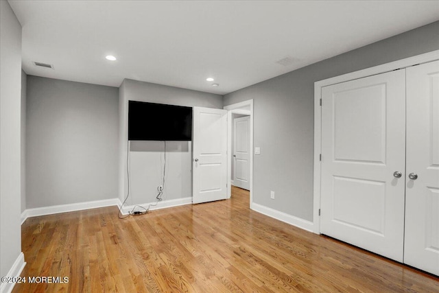 unfurnished bedroom featuring light hardwood / wood-style floors