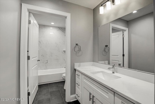 full bathroom with toilet, vanity, tiled shower / bath combo, and tile patterned flooring