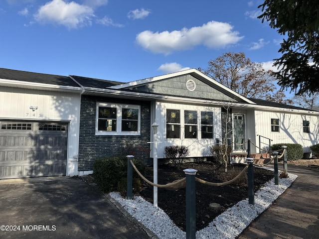 ranch-style home with a garage