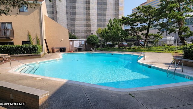 view of swimming pool featuring a patio