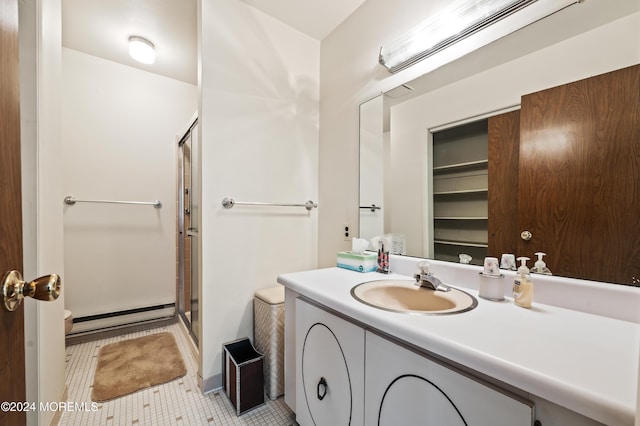 1 Dixon Ct Unit B, Whiting, NJ 08759 - full bathroom with a baseboard heating unit, a shower stall, vanity, and tile patterned floors