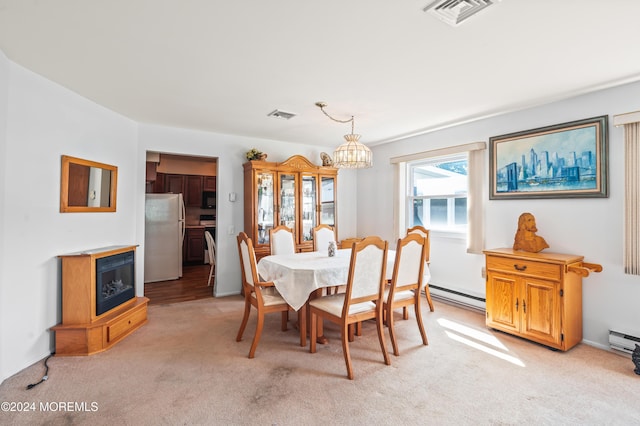 1 Dixon Ct Unit B, Whiting, NJ 08759 - dining space with light carpet, a chandelier, and a baseboard heating unit