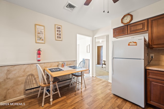 1 Dixon Ct Unit B, Whiting, NJ 08759 - dining space with light wood-style floors, a ceiling fan, and a baseboard radiator