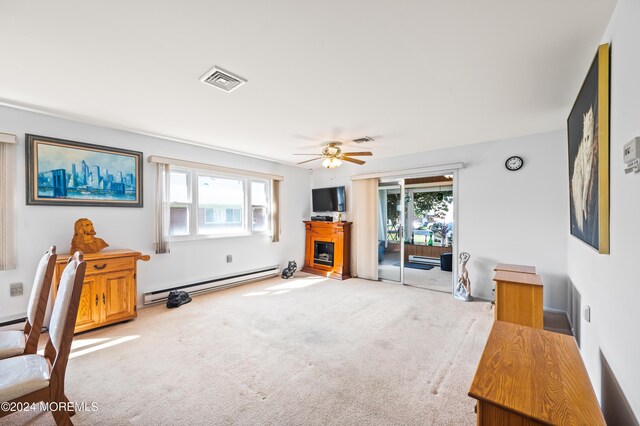 1 Dixon Ct Unit B, Whiting, NJ 08759 - unfurnished living room featuring a baseboard radiator, a fireplace, healthy amount of natural light, and carpet flooring