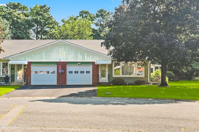 1 Dixon Ct Unit B, Whiting, NJ 08759 - view of front of property featuring a garage, driveway, a front lawn, and roof with shingles