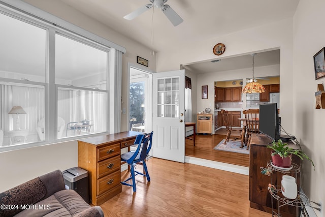 office area with ceiling fan and light hardwood / wood-style flooring