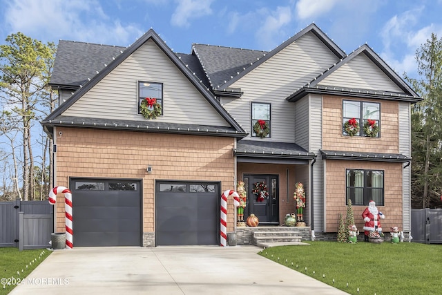 view of front facade featuring a garage and a front lawn