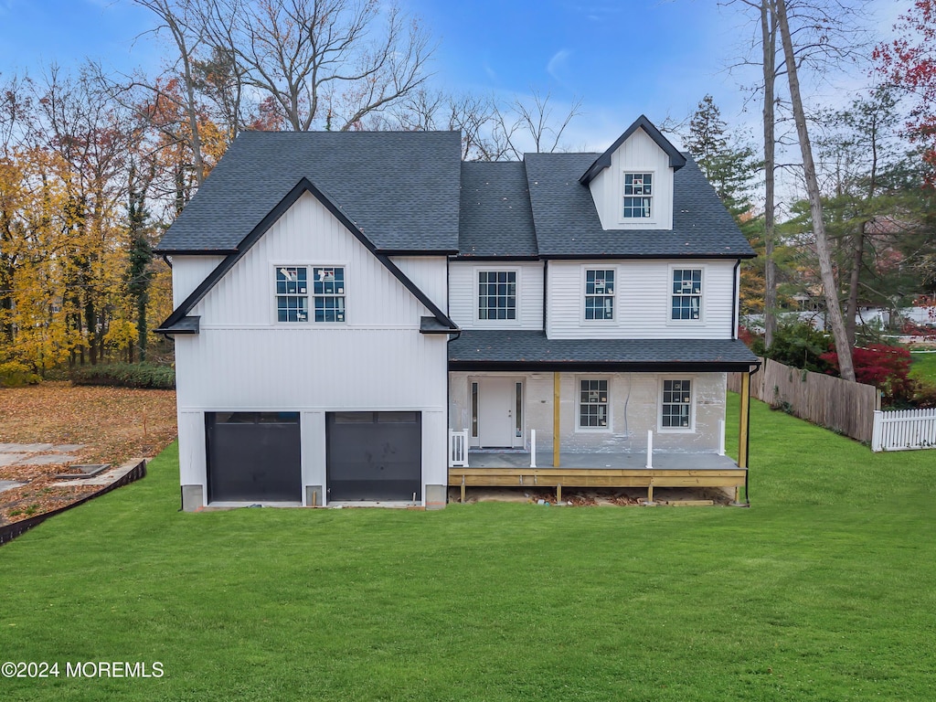 exterior space featuring a front lawn and a garage