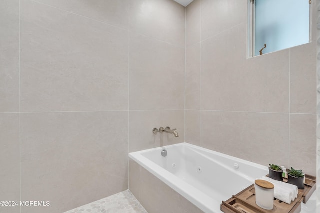 bathroom with tiled tub