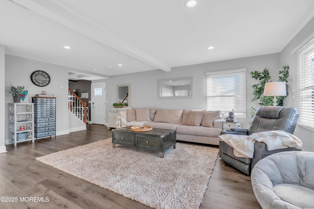 living room with beamed ceiling and hardwood / wood-style flooring