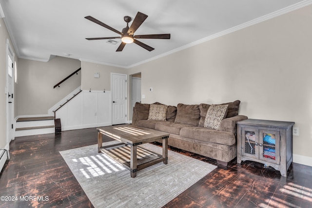 living room with ceiling fan, ornamental molding, and dark wood-type flooring