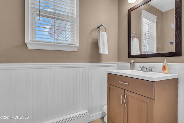 bathroom featuring vanity and a baseboard heating unit