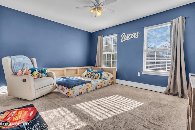 carpeted bedroom featuring ceiling fan