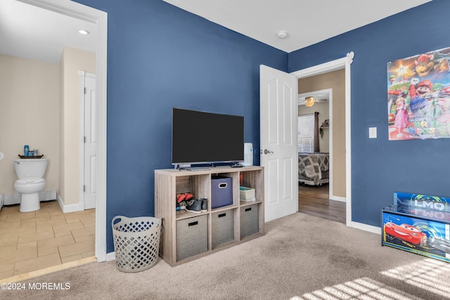 playroom with carpet and ceiling fan