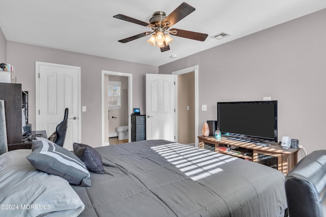 bedroom featuring ceiling fan and connected bathroom