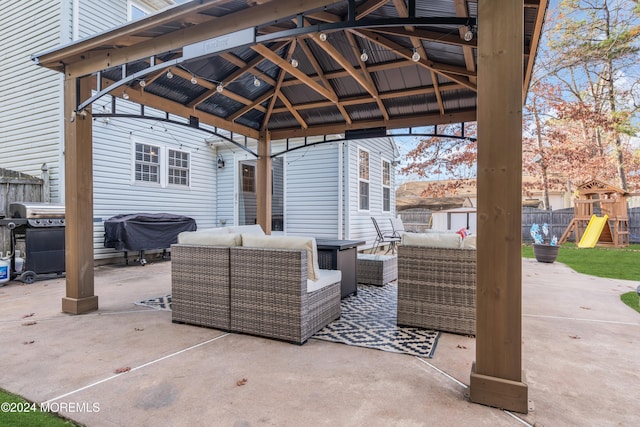 view of patio / terrace featuring a gazebo, an outdoor hangout area, a playground, and grilling area