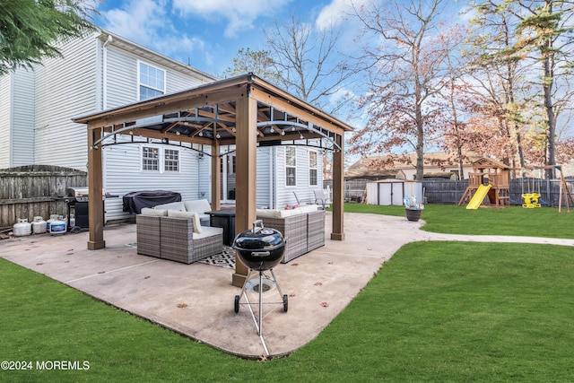 view of patio / terrace with outdoor lounge area, a gazebo, a shed, a grill, and a playground