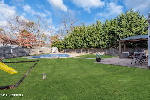 view of yard with a gazebo and a patio area