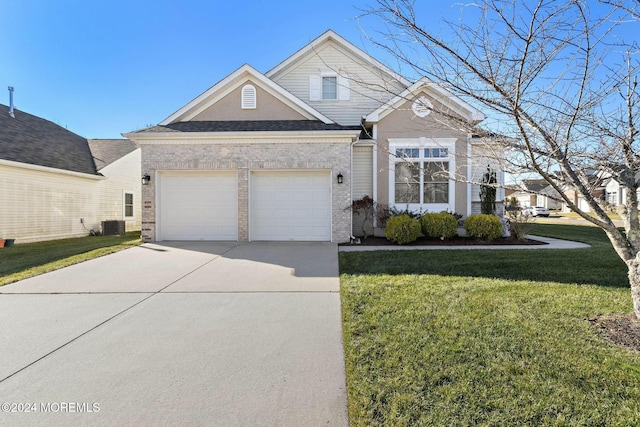 view of front of property featuring a garage, central air condition unit, and a front lawn