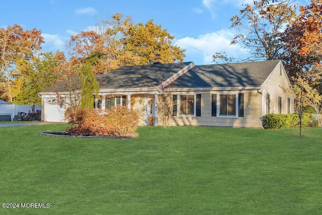 ranch-style house with a garage and a front yard