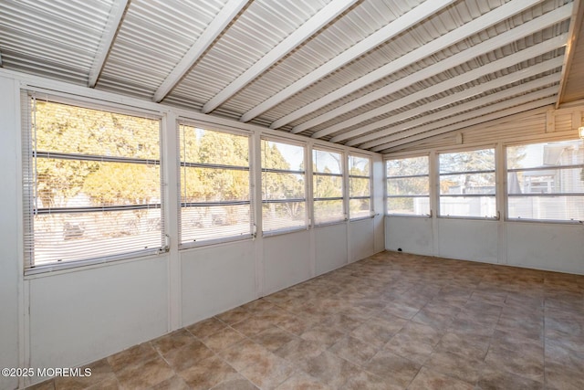 unfurnished sunroom with lofted ceiling and a wealth of natural light