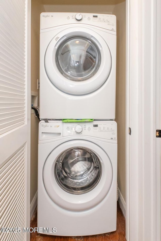 washroom with stacked washer / drying machine