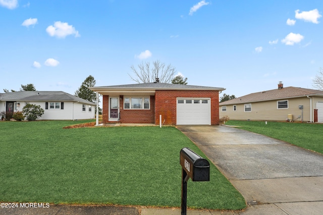 ranch-style home featuring a front lawn and a garage