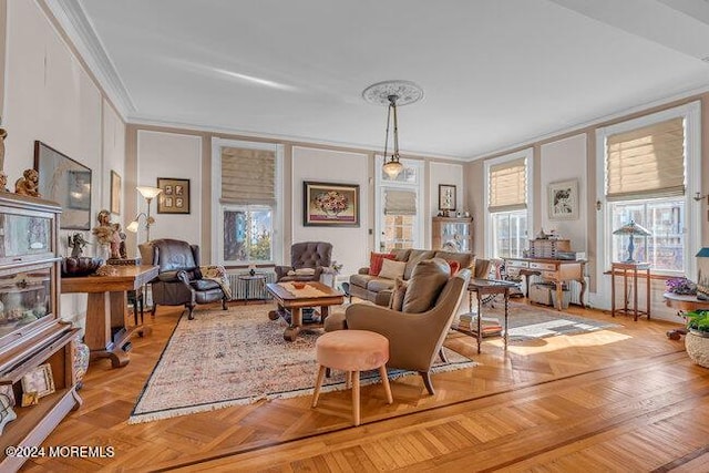 living room with light parquet floors and ornamental molding