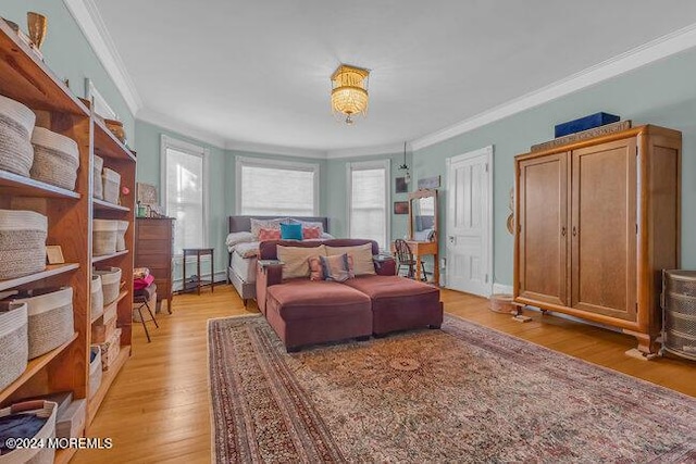 interior space with light hardwood / wood-style floors and crown molding