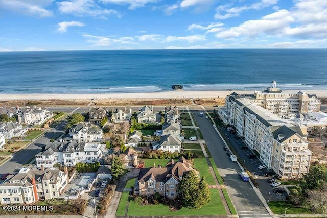 aerial view with a view of the beach and a water view