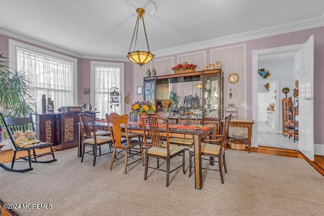 dining room featuring ornamental molding