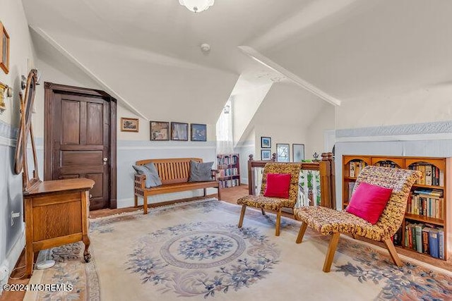 living area featuring vaulted ceiling