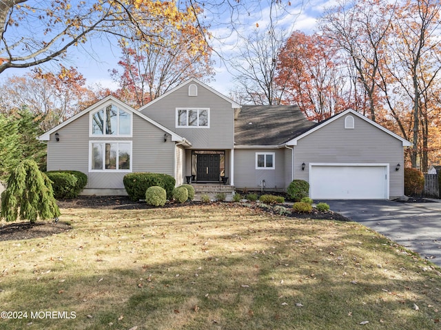 front of property featuring a garage and a front lawn